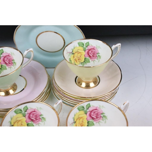 144 - Set of six Cavour Ware trios, each with printed roses to the inside of the cups and gilt rims. All m... 