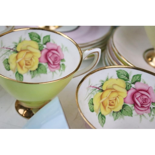 144 - Set of six Cavour Ware trios, each with printed roses to the inside of the cups and gilt rims. All m... 