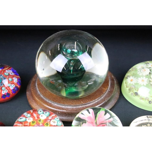 146 - Collection of paperweights to include three millefiori cane examples, a large green twist example, p... 