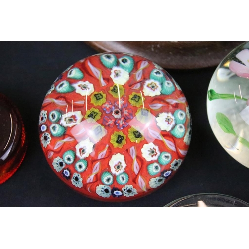 146 - Collection of paperweights to include three millefiori cane examples, a large green twist example, p... 