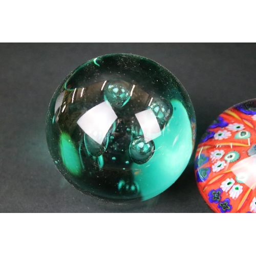 146 - Collection of paperweights to include three millefiori cane examples, a large green twist example, p... 