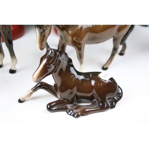 153 - Group of ceramic horses to include a three Beswick horses with 2 white feet, a Beswick recumbent hor... 