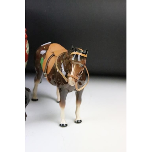 153 - Group of ceramic horses to include a three Beswick horses with 2 white feet, a Beswick recumbent hor... 