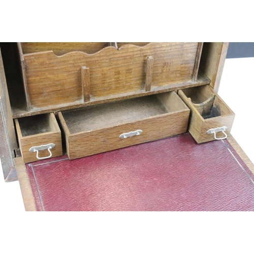 179 - Early 20th Century Edwardian oak desk tidy. The box having a fall front to revealing sectioned inter... 