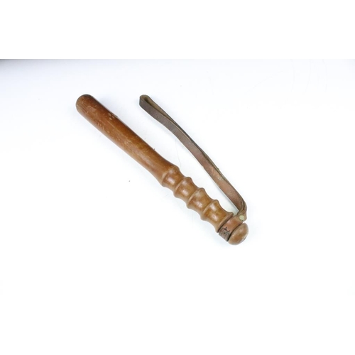 188 - 20th Century policeman's truncheon having a turned handle and leather strap, together with a 'the Me... 