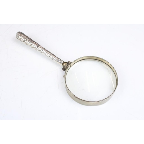 188A - Late 19th / early 20th century magnifying glass, the white metal handle with scrolling Acanthus leaf... 