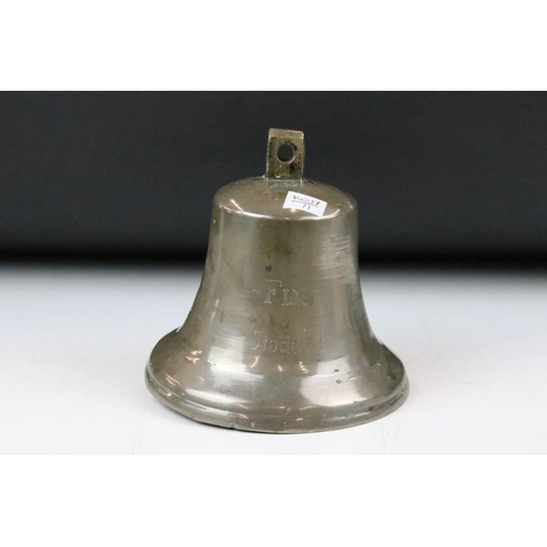 190 - 20th Century ships bell inscribed Fix Stockholm to the side. Measures approx 17cm tall.