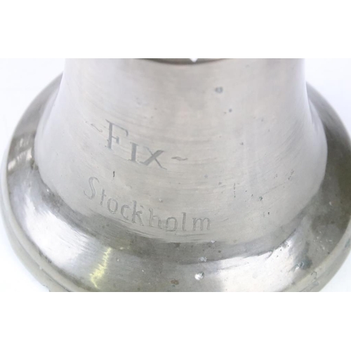 190 - 20th Century ships bell inscribed Fix Stockholm to the side. Measures approx 17cm tall.