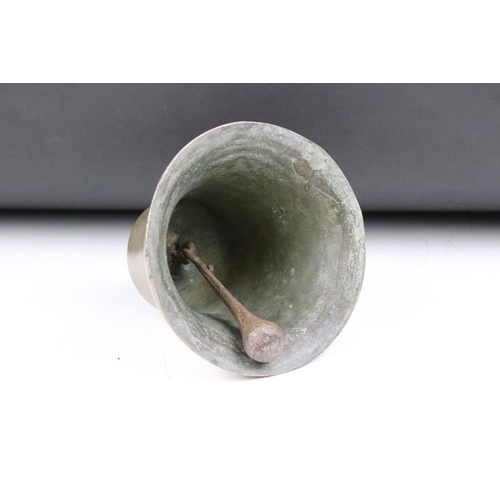 190 - 20th Century ships bell inscribed Fix Stockholm to the side. Measures approx 17cm tall.