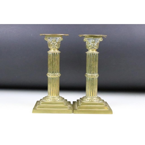 193 - Pair of cast brass neoclassical candlesticks in the form of reeded composite columns, together with ... 