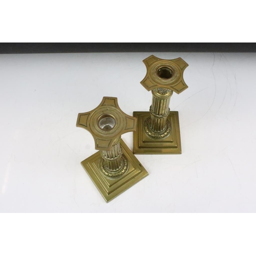 193 - Pair of cast brass neoclassical candlesticks in the form of reeded composite columns, together with ... 