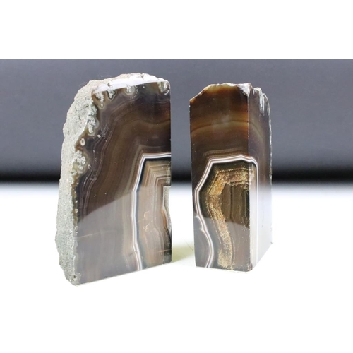 196 - Two pairs of polished agate geode specimen book ends. One pair measures 16.5cm tall, the other 17cm.