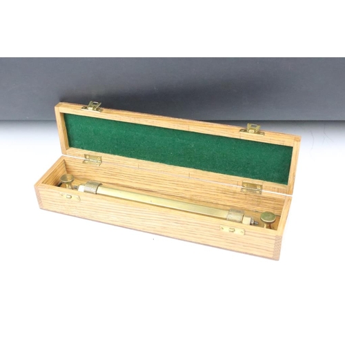 197 - Cooke & Troughton & Simms Ltd rolling rule tool complete in footed wooden box. Box measures 33cm wid... 