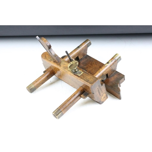 205 - Two vintage wooden planes with brass details, to include a plough plane and a screw-stem example. Wi... 