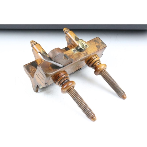 205 - Two vintage wooden planes with brass details, to include a plough plane and a screw-stem example. Wi... 