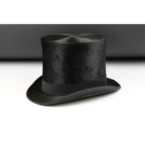 211 - Woodrow & Sons of Manchester black silk top hat having a ventilation hole to top. Interior rim measu... 