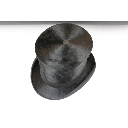 211 - Woodrow & Sons of Manchester black silk top hat having a ventilation hole to top. Interior rim measu... 