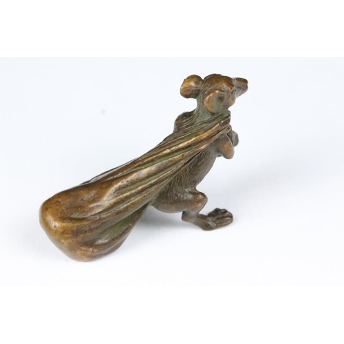 219 - An ornamental Solid bronze lucky fortune rat with bag.