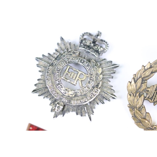 229 - A small collection of military badges to include enamel examples