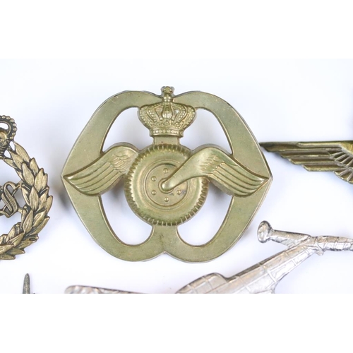 229 - A small collection of military badges to include enamel examples