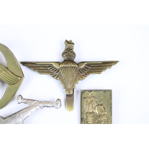 229 - A small collection of military badges to include enamel examples