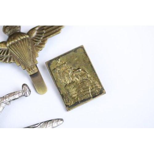 229 - A small collection of military badges to include enamel examples