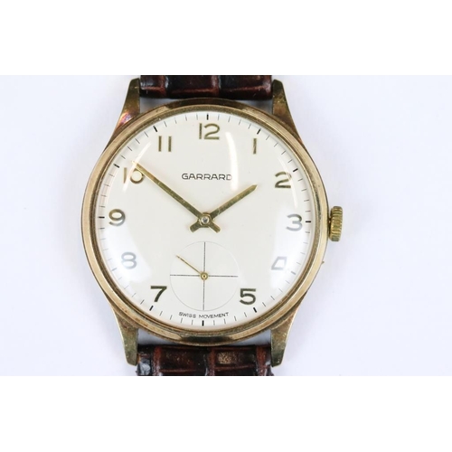 234 - A gents 9ct gold cased Garrards wristwatch presented by Rolls Royce in 1981.