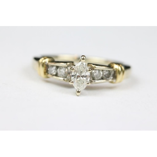 259 - Yellow Gold Ring set with central Marquoise Diamond and Round Cuts to the shoulders