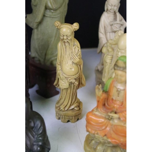 327 - A group of oriental collectables to include carved ornamental fugures, snuff bottle and cast metal f... 