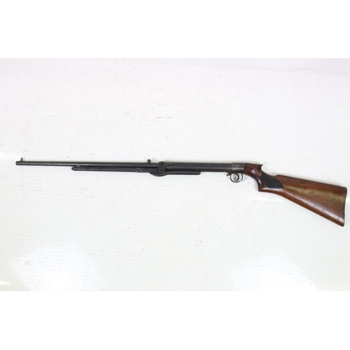 318 - A vintage B.S.A. air rifle, BSA logo carved to the polished wooden, overall length approx 110cm.