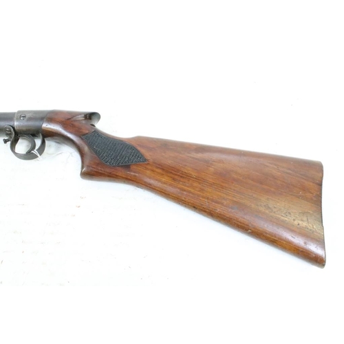 318 - A vintage B.S.A. air rifle, BSA logo carved to the polished wooden, overall length approx 110cm.