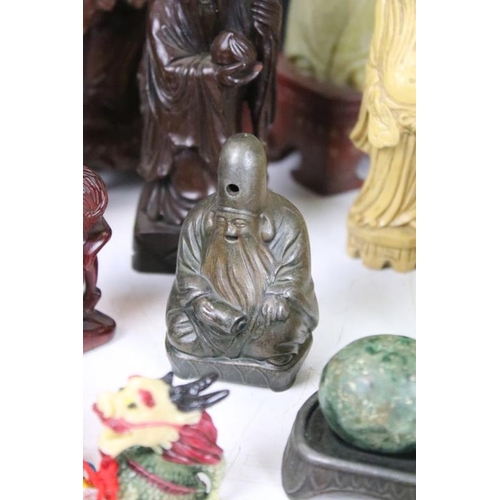 327 - A group of oriental collectables to include carved ornamental fugures, snuff bottle and cast metal f... 