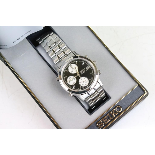 337 - A collection of four gents stainless steel cased Seiko Chronograph wristwatches all complete with bo... 