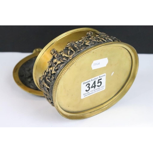 345 - A decorative gilt metal jewellery box / casket with figural decoration.