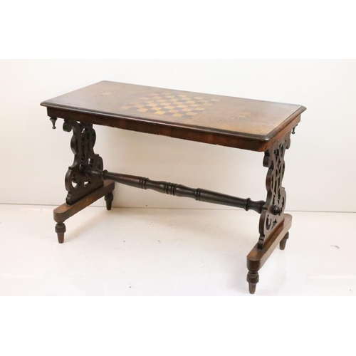 556 - Victorian Walnut Side / Games Table, the top with marquetry chess board inlay, raised on two shaped ... 