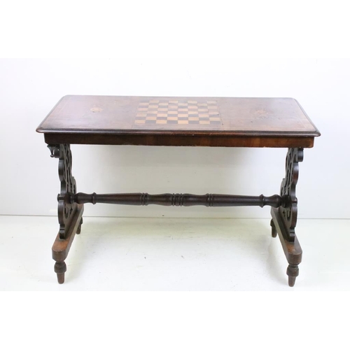 556 - Victorian Walnut Side / Games Table, the top with marquetry chess board inlay, raised on two shaped ... 