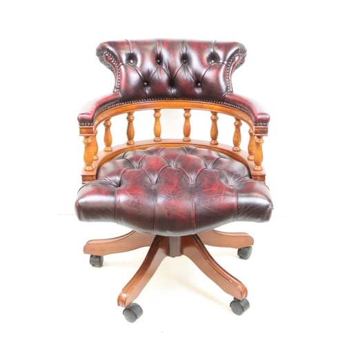 561 - Victorian style Swivel Office Elbow Chair with ox blood red leather button upholstery, 64cm wide x 7... 