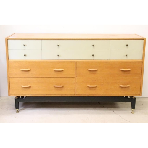 567 - Mid century Retro E. Gomme G-Plan ' Brandon ' Golden Oak and White Sideboard or Chest with an arrang... 