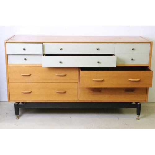 567 - Mid century Retro E. Gomme G-Plan ' Brandon ' Golden Oak and White Sideboard or Chest with an arrang... 