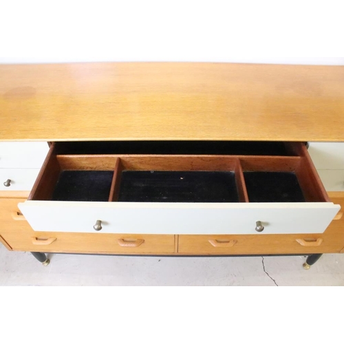 567 - Mid century Retro E. Gomme G-Plan ' Brandon ' Golden Oak and White Sideboard or Chest with an arrang... 