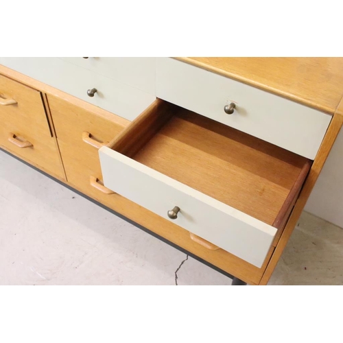 567 - Mid century Retro E. Gomme G-Plan ' Brandon ' Golden Oak and White Sideboard or Chest with an arrang... 