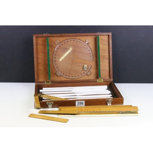 356 - A collection of vintage boxwood rulers to include Rabone folding examples together with a surveyors ... 