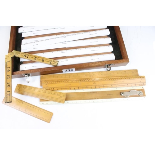 356 - A collection of vintage boxwood rulers to include Rabone folding examples together with a surveyors ... 