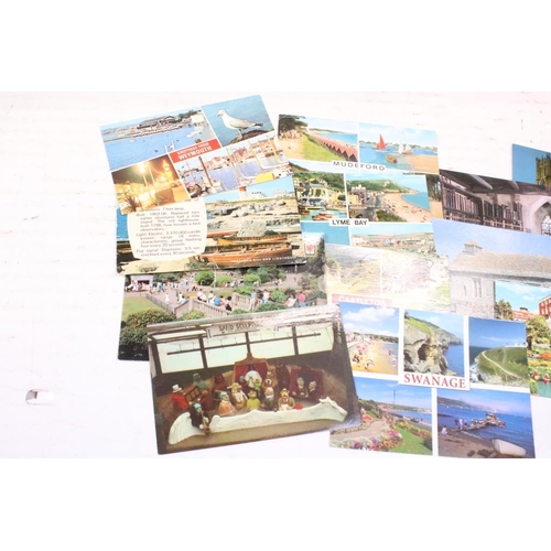 384 - Extensive collection of late 20th century postcards contained within 13 boxes / albums, covering a r... 