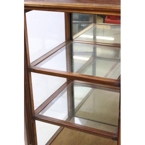 577 - Edwardian Mahogany Square Display Cabinet, with glazing to three sides, the single door opening to t... 