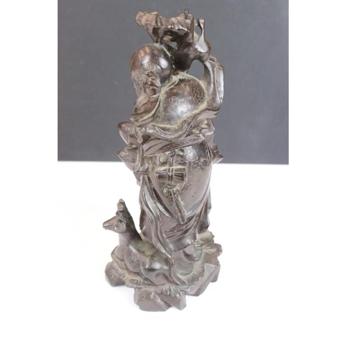 361 - Chinese carved hardwood figure depicting Shou Lau with a crane and deer to the naturalistic base. Me... 