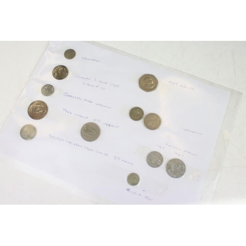 366 - A small collection of coins and banknotes to include World War Two issued examples.