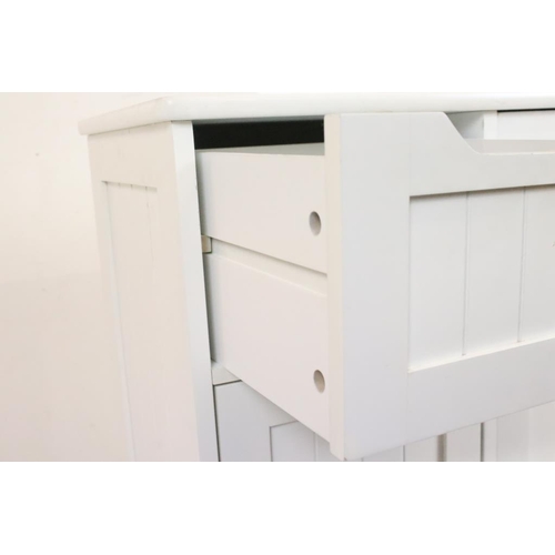 609 - Pair of White Cabinets, each with four short drawers and a cupboard door, each 56cm wide x 30cm deep... 