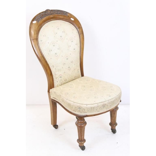 613 - Victorian Walnut Framed Spoon Back Upholstered Nursing Chair, raised on turned front legs with casto... 