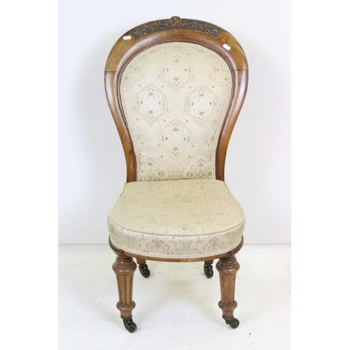 613 - Victorian Walnut Framed Spoon Back Upholstered Nursing Chair, raised on turned front legs with casto... 